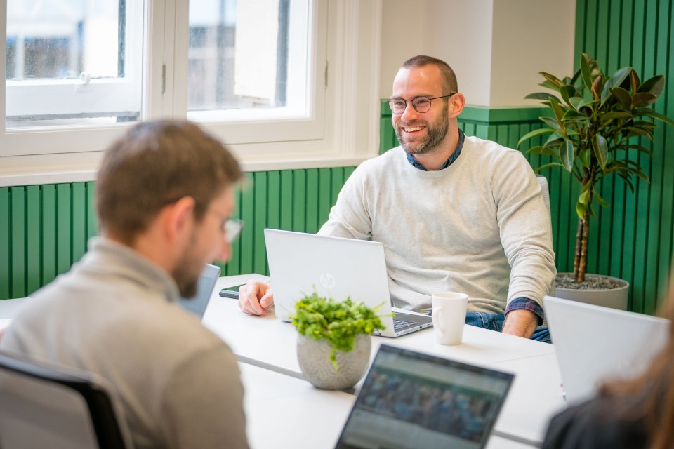 2 remote workers sharing a desk