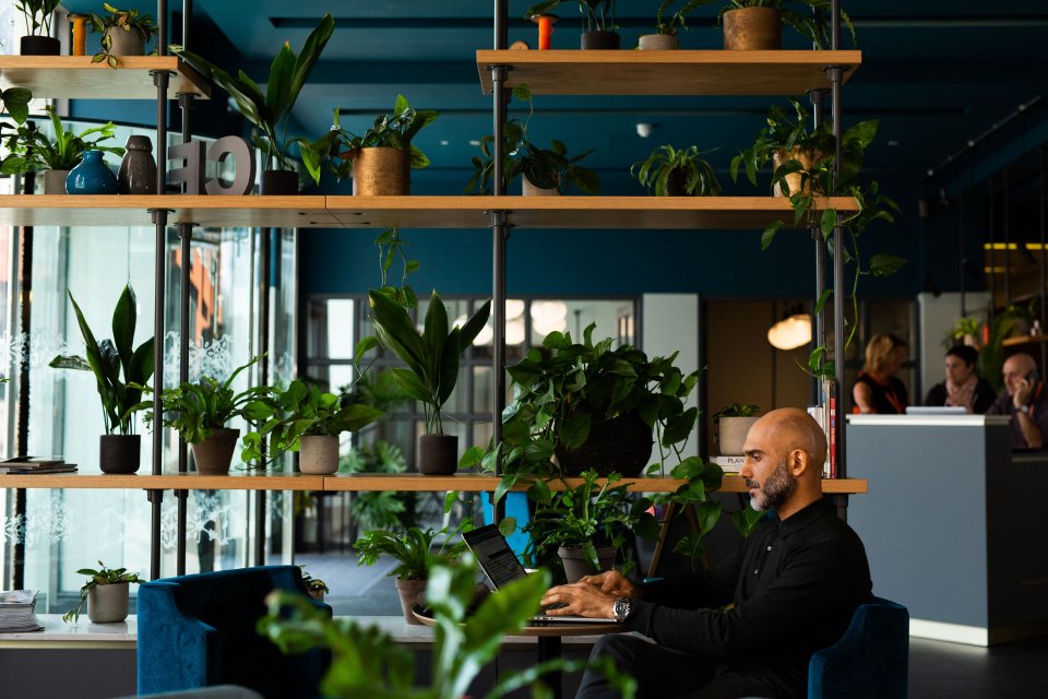 Remote worker working on his own at a desk in a shared coworking office