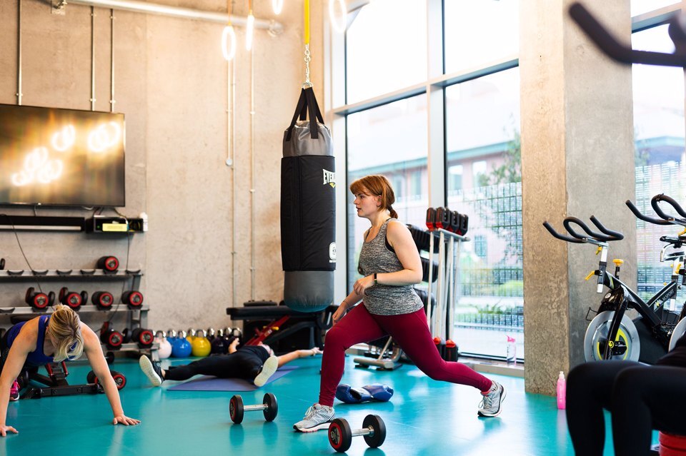 3 people exercising in a studio gym at Manchester Science Park