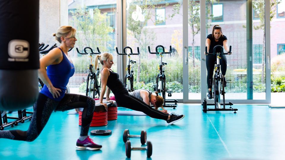 Group of people working out in at the gym