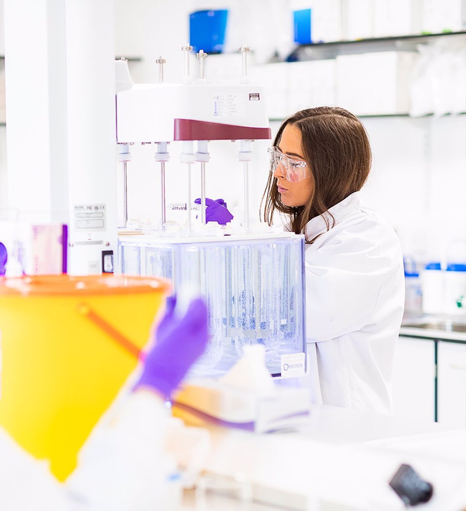 A woman working in a lab at Alderley Park