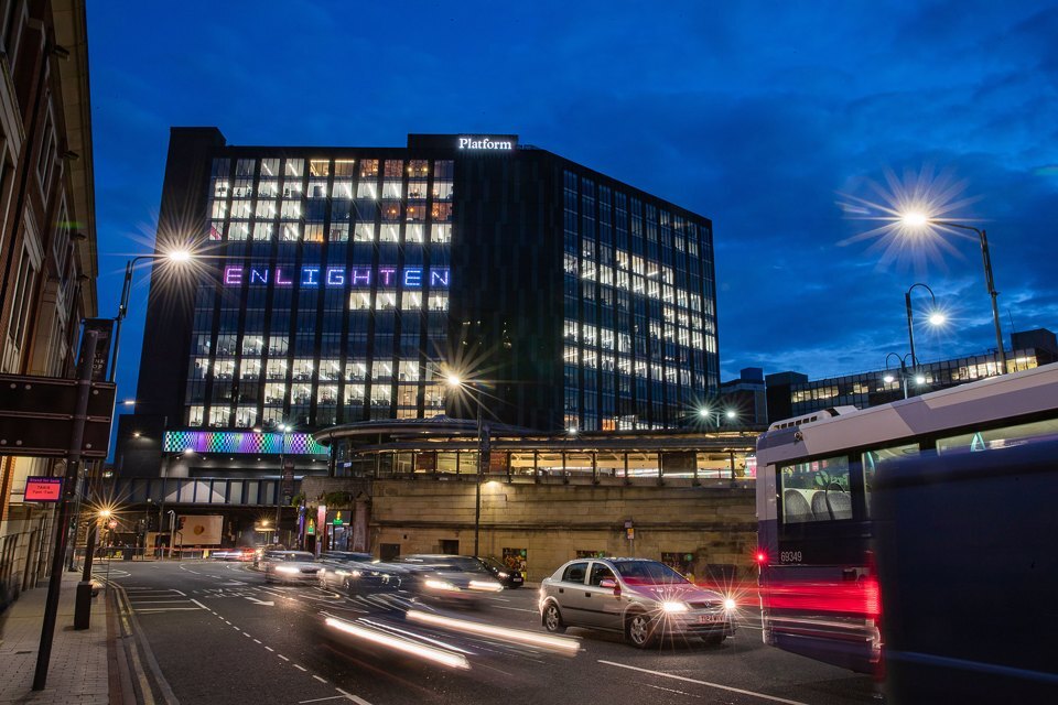 Outside view of the Platform building and the surrounding busy city area at night