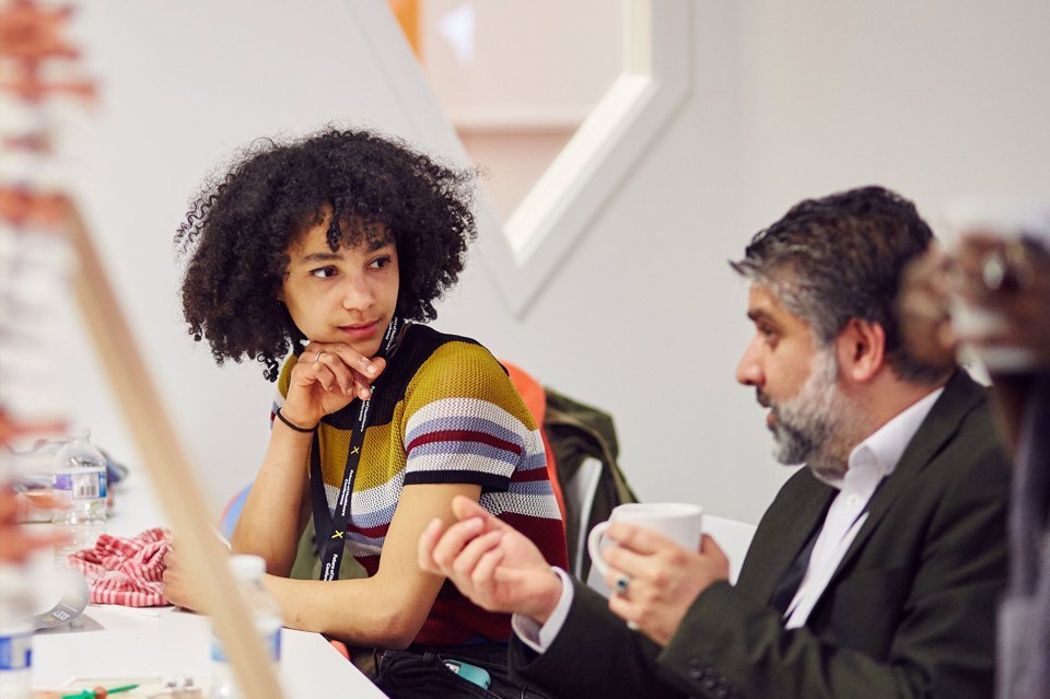 A woman and a man having a discussion over lunch